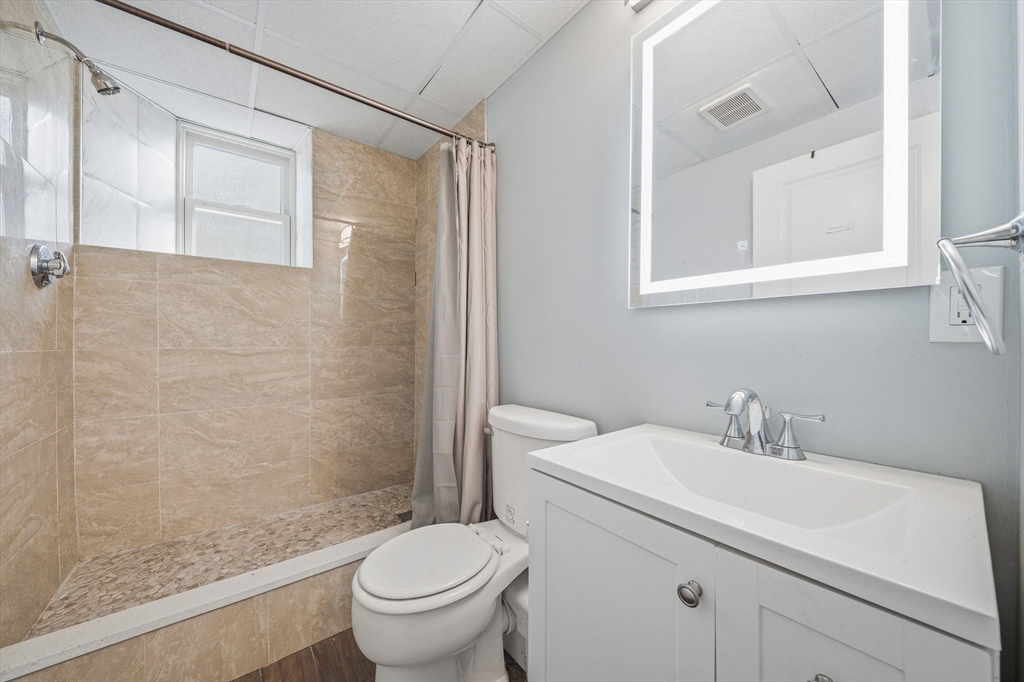5 Main Street Quincy, MA 02169 - Photo 27 of 42 a bathroom with a sink toilet and shower