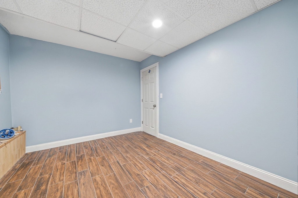 5 Main Street Quincy, MA 02169 - Photo 30 of 42 a view of room with wooden floor