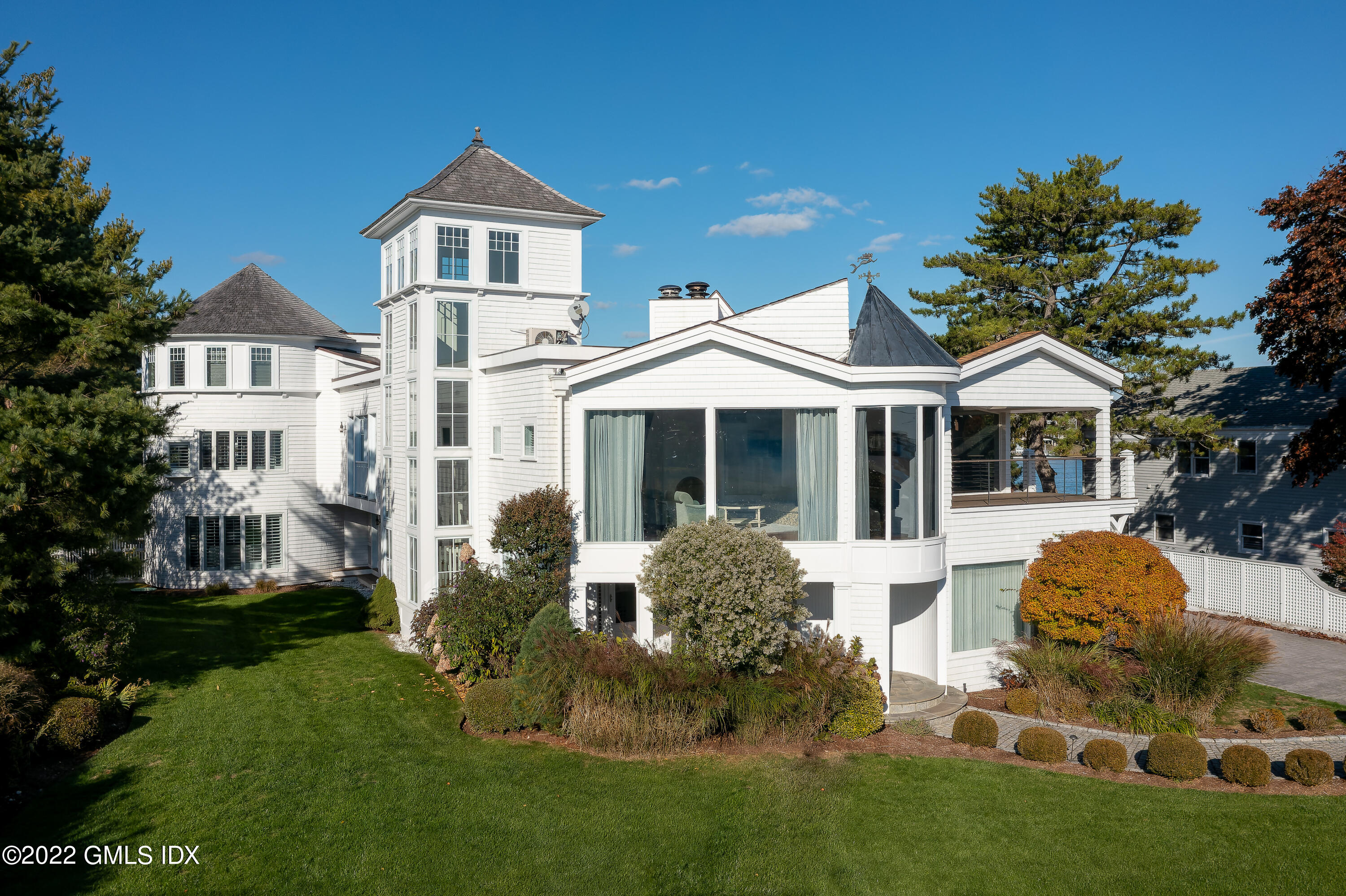 30 Surf Road Westport, CT 06880 - Photo 2 of 59 a front view of a house with a yard