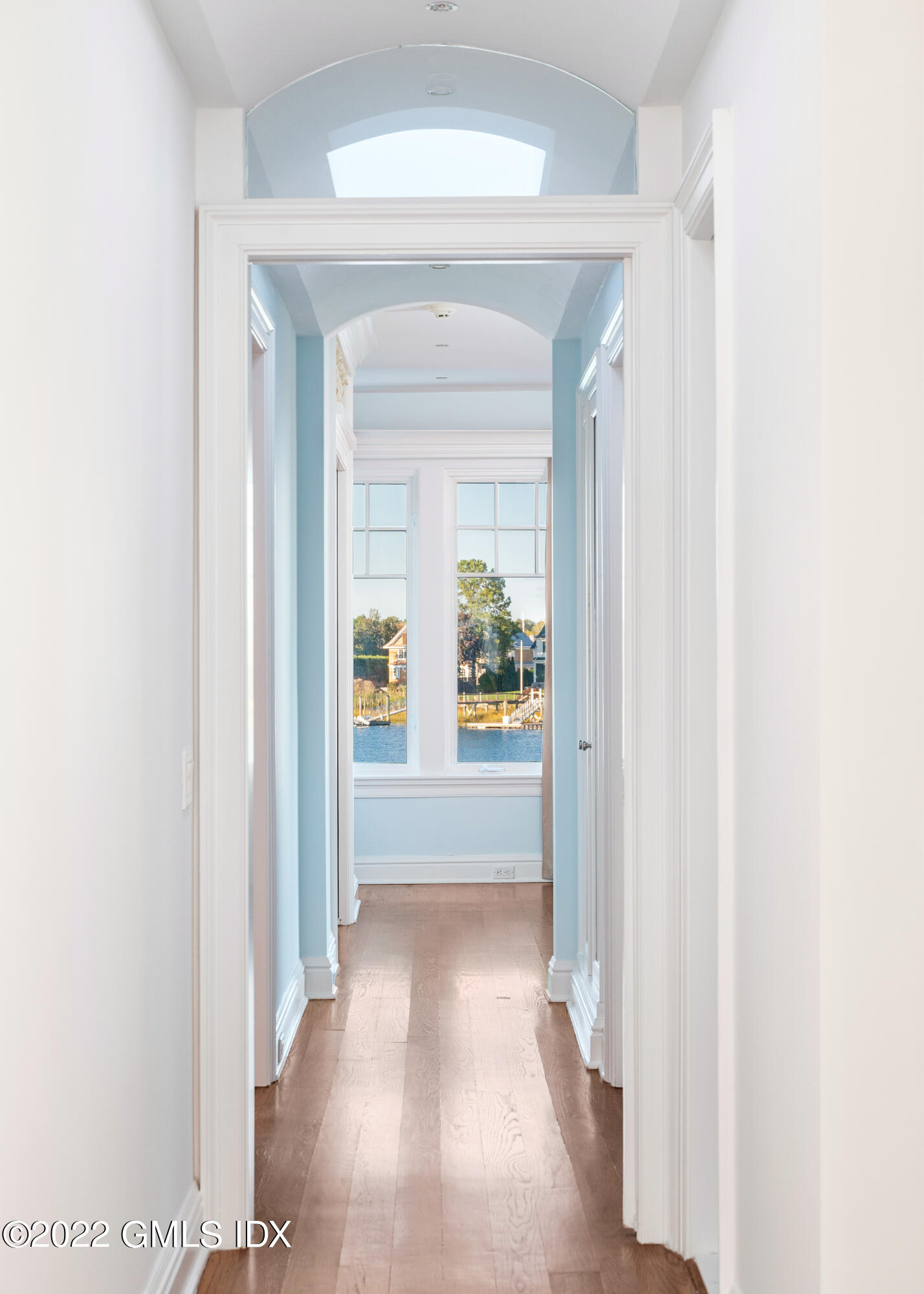 30 Surf Road Westport, CT 06880 - Photo 21 of 59 a view of a hallway with wooden floor and a dining room