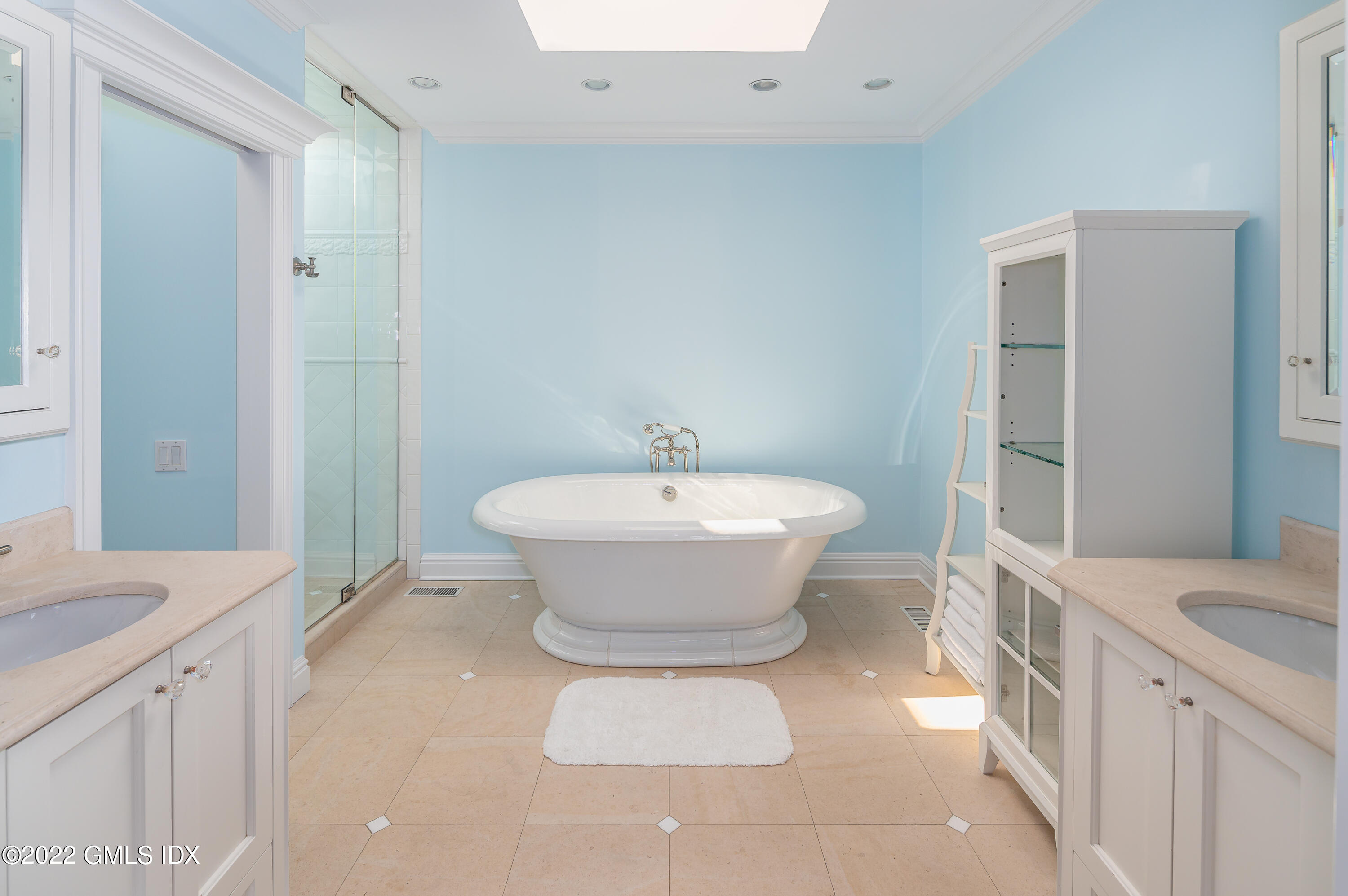 30 Surf Road Westport, CT 06880 - Photo 23 of 59 a view of a bathroom with a sink and mirror