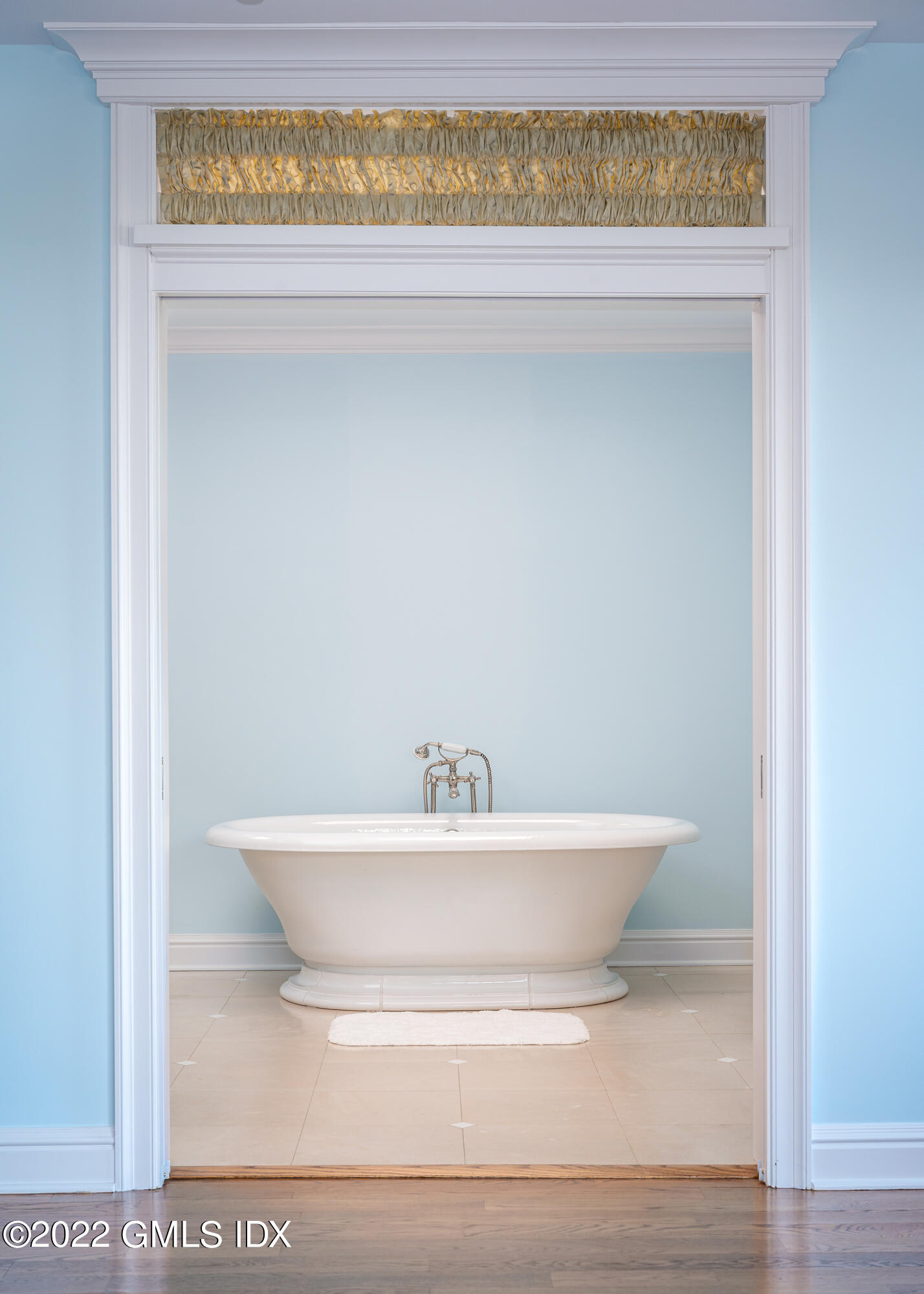 30 Surf Road Westport, CT 06880 - Photo 24 of 59 a bathroom with a sink and a mirror