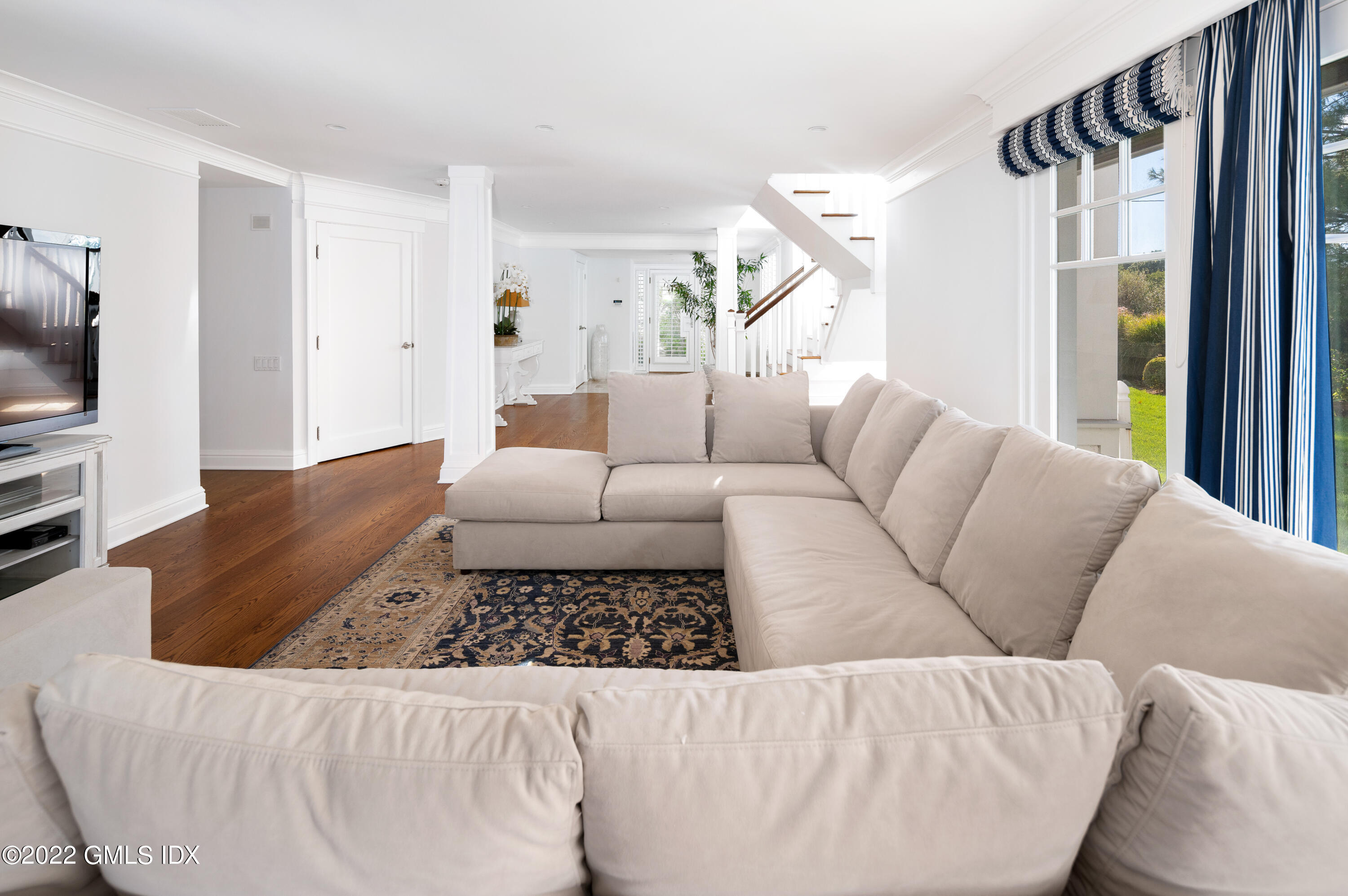 30 Surf Road Westport, CT 06880 - Photo 27 of 59 a living room with furniture and a flat screen tv