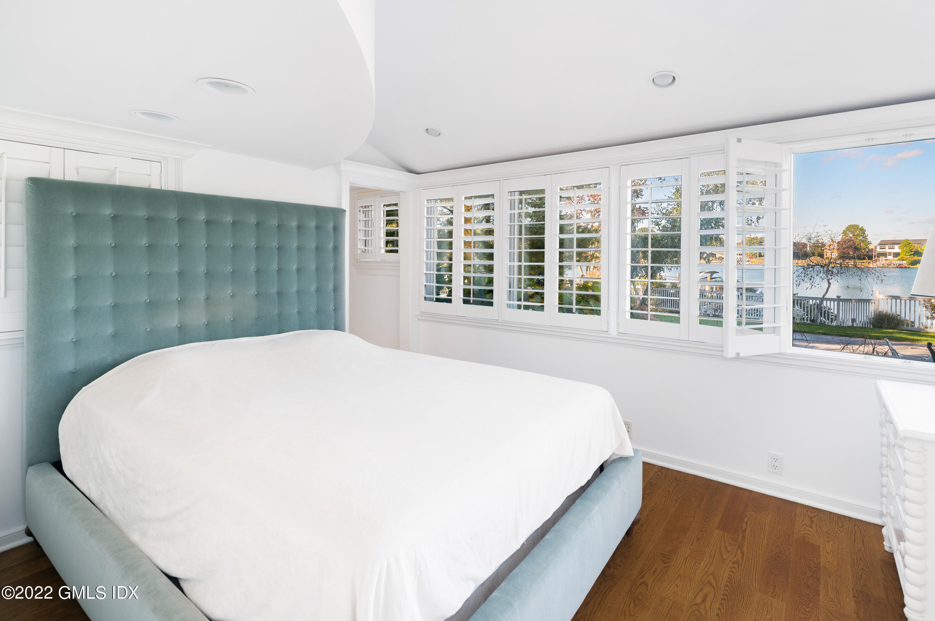 30 Surf Road Westport, CT 06880 - Photo 29 of 59 a bedroom with a large bed and a large window