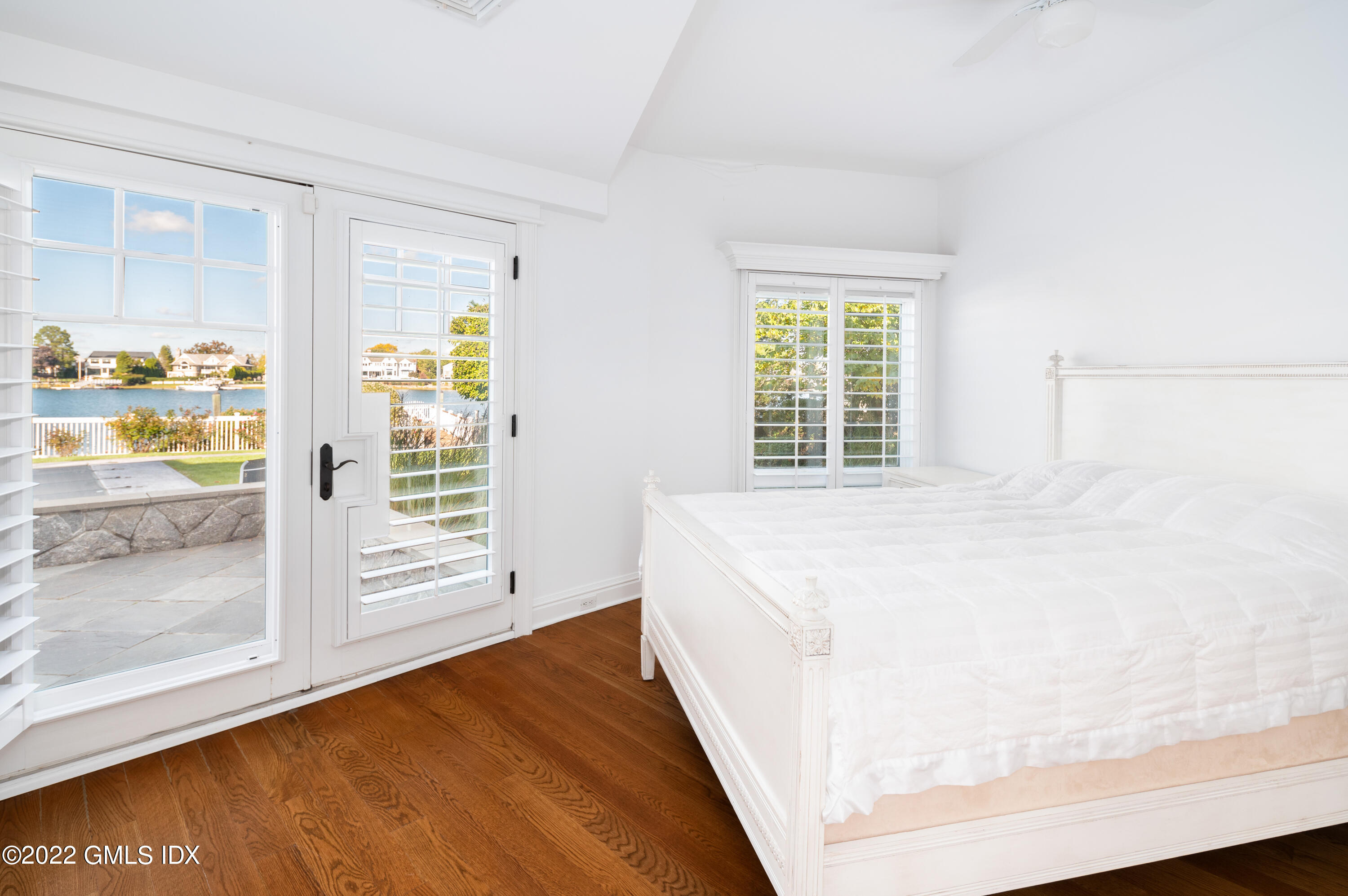 30 Surf Road Westport, CT 06880 - Photo 32 of 59 a spacious bedroom with a bed and a window