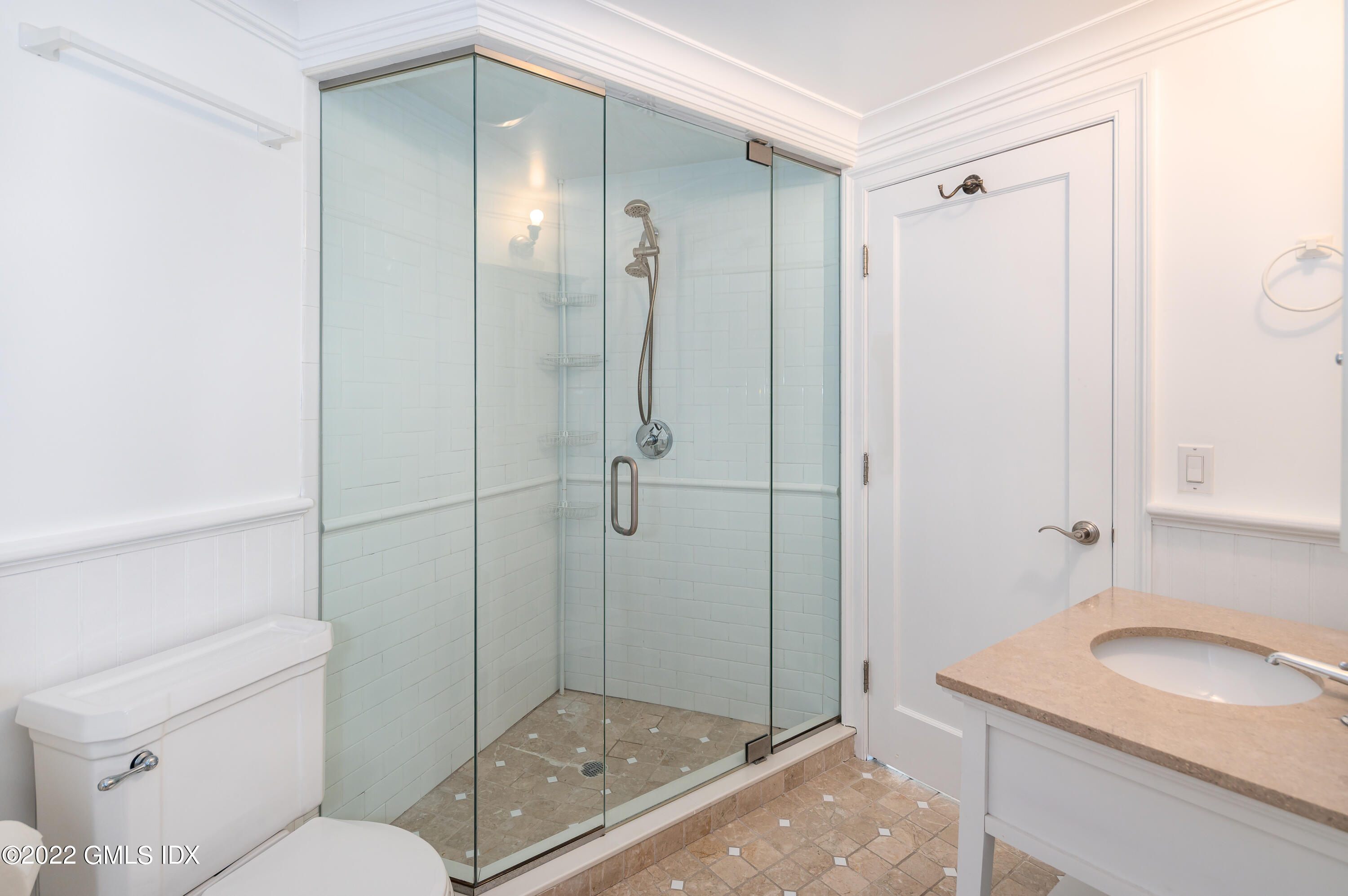 30 Surf Road Westport, CT 06880 - Photo 35 of 59 a bathroom with a granite countertop sink a mirror and a shower