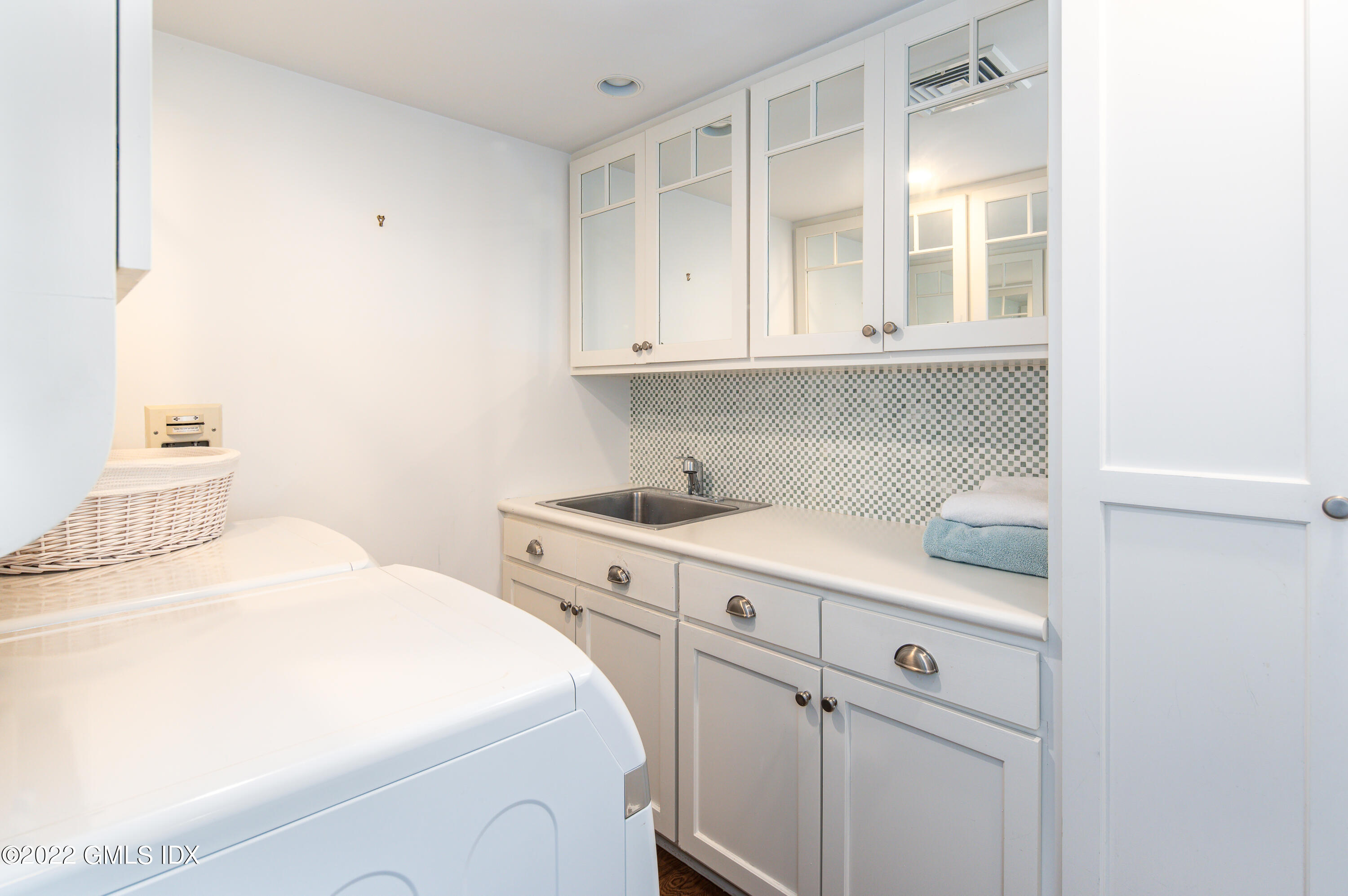 30 Surf Road Westport, CT 06880 - Photo 36 of 59 a bedroom with a bed and a cabinets