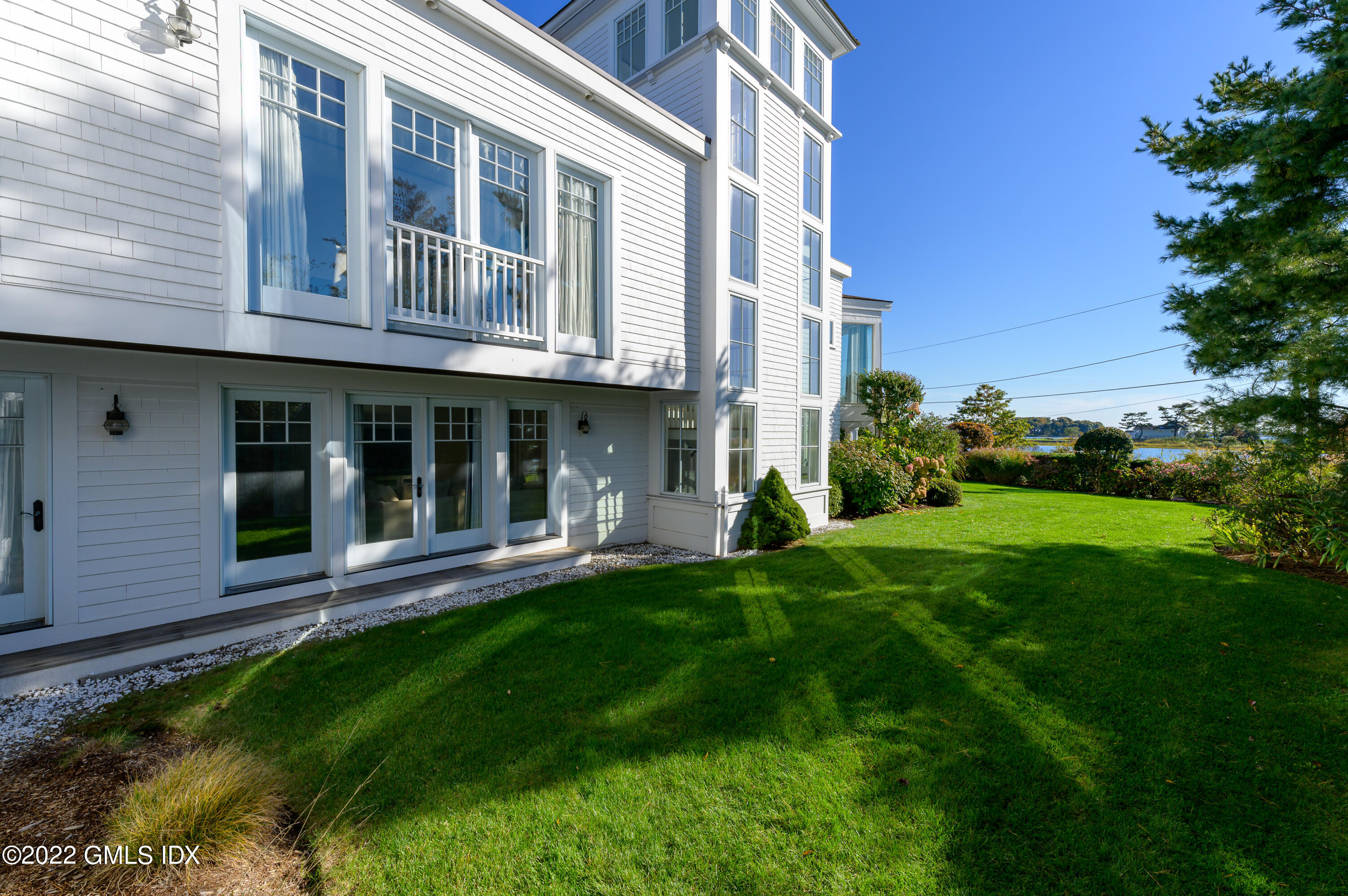 30 Surf Road Westport, CT 06880 - Photo 44 of 59 a view of a house with a yard and plants