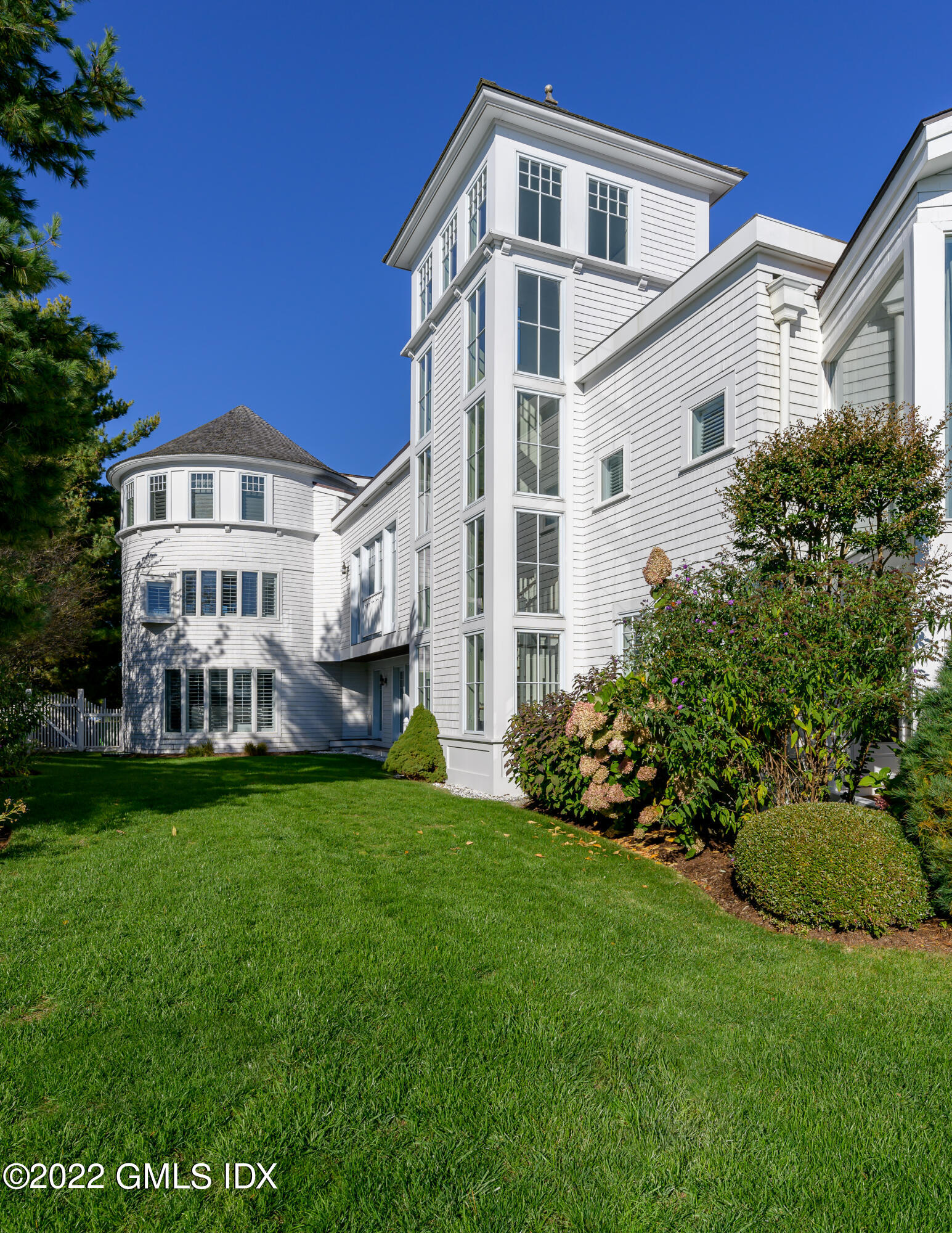 30 Surf Road Westport, CT 06880 - Photo 45 of 59 a front view of a house with a garden