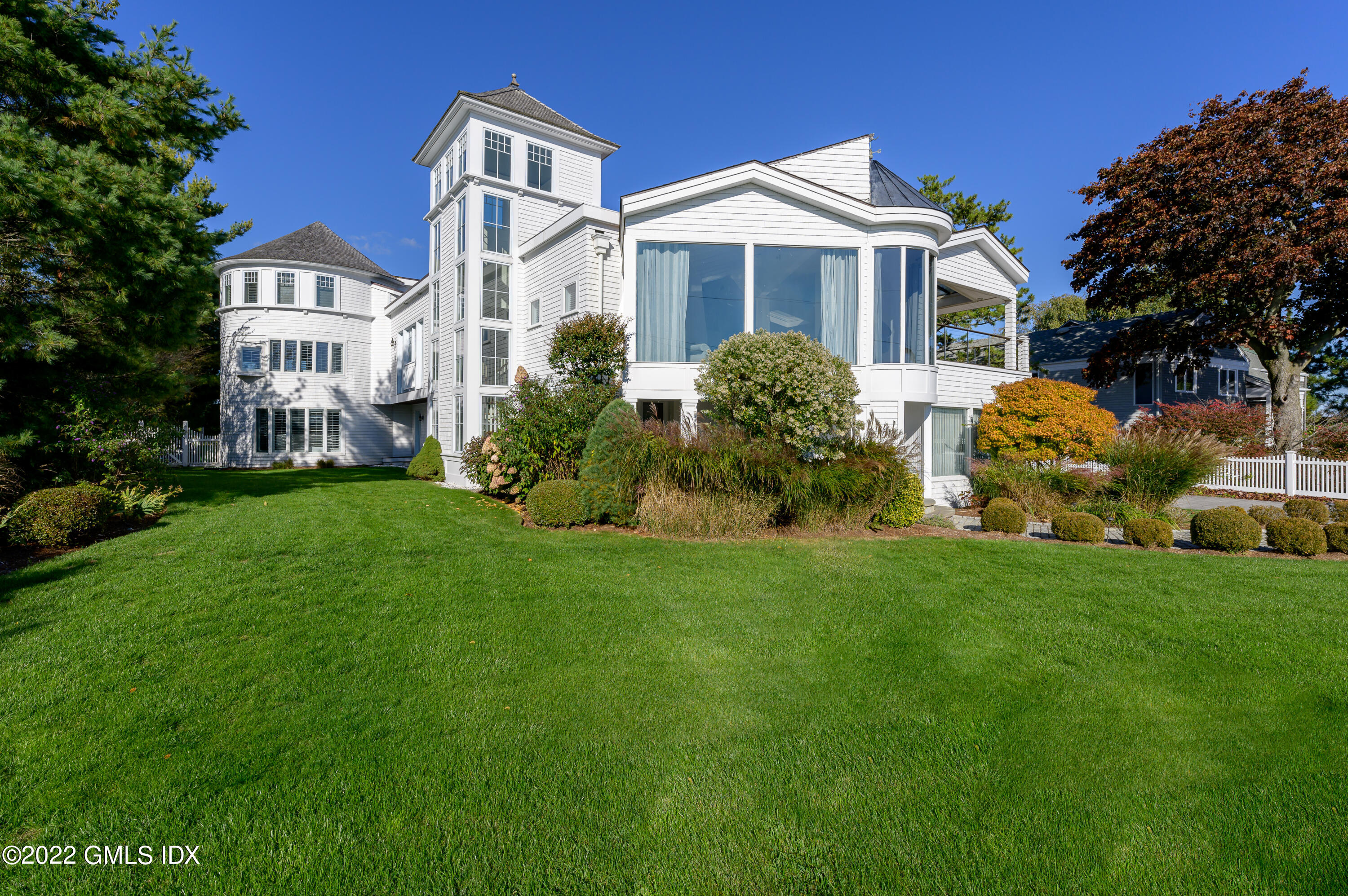 30 Surf Road Westport, CT 06880 - Photo 51 of 59 a front view of a house with a garden