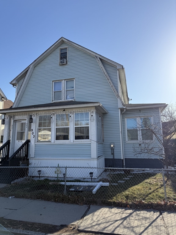 903 Liberty Street Springfield, MA 01104 - Photo 1 of 2 a front view of a house with a yard