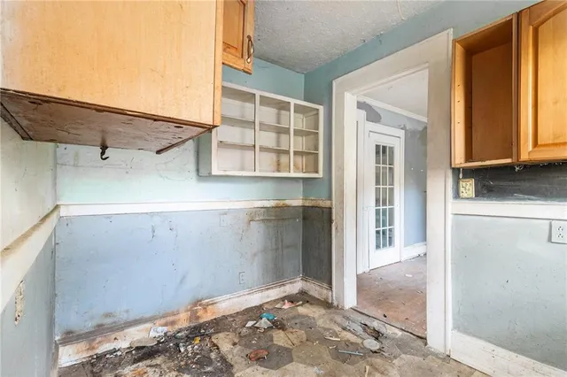 a view of a closet area with an empty room