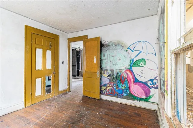 a view of an entryway with wooden floor