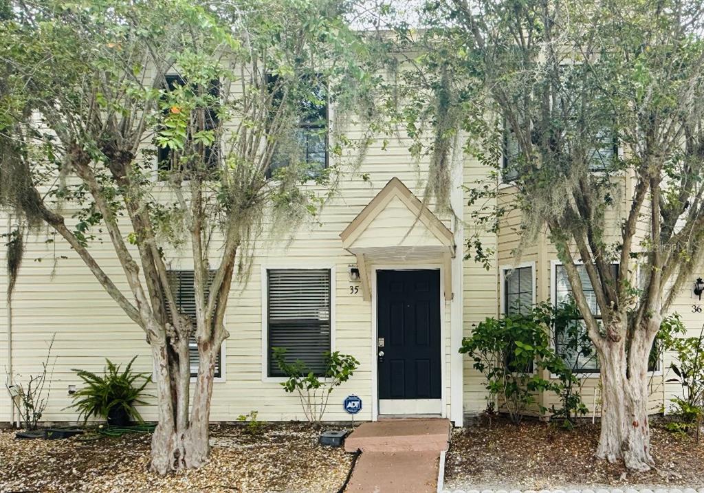 2302 South Maki Road, Unit 35 Plant City, FL 33563 - Photo 1 of 1 a front view of a house with garden