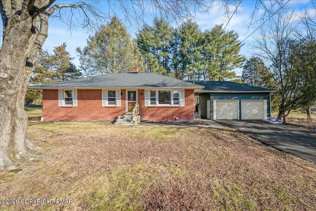 front view of a house with a yard