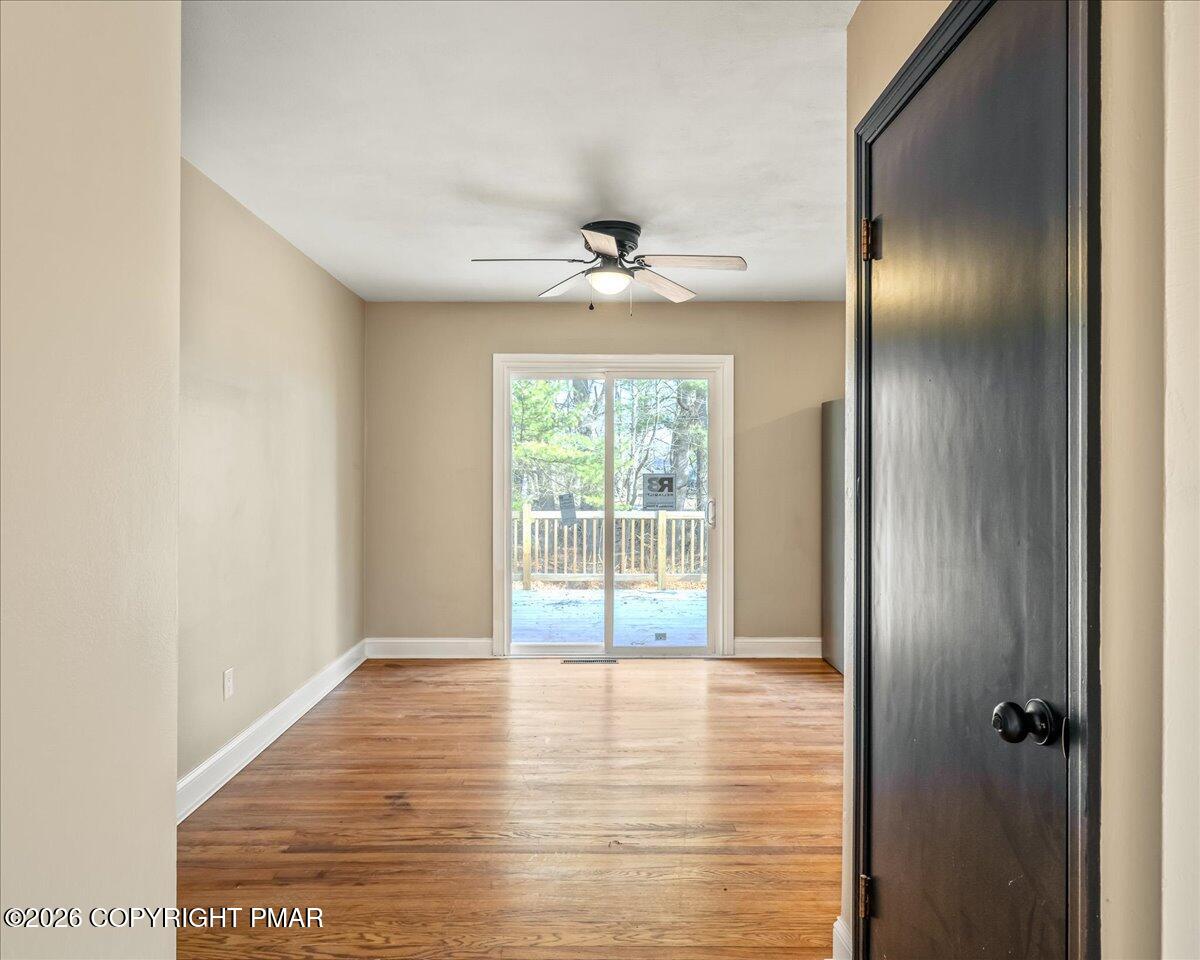 7136 Howell Terrace Stroudsburg, PA 18360 - Photo 11 of 35 a view of a livingroom with a ceiling fan and window