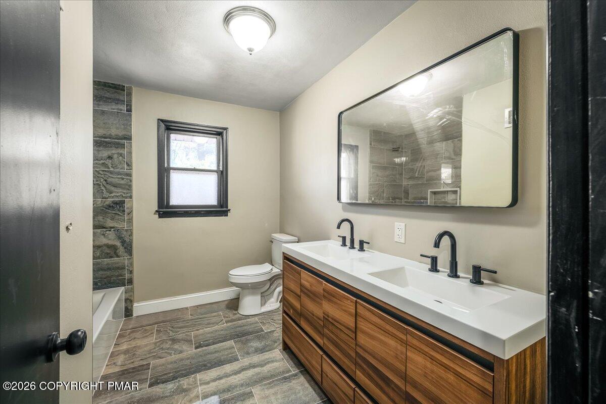 7136 Howell Terrace Stroudsburg, PA 18360 - Photo 13 of 35 a bathroom with a sink and a mirror