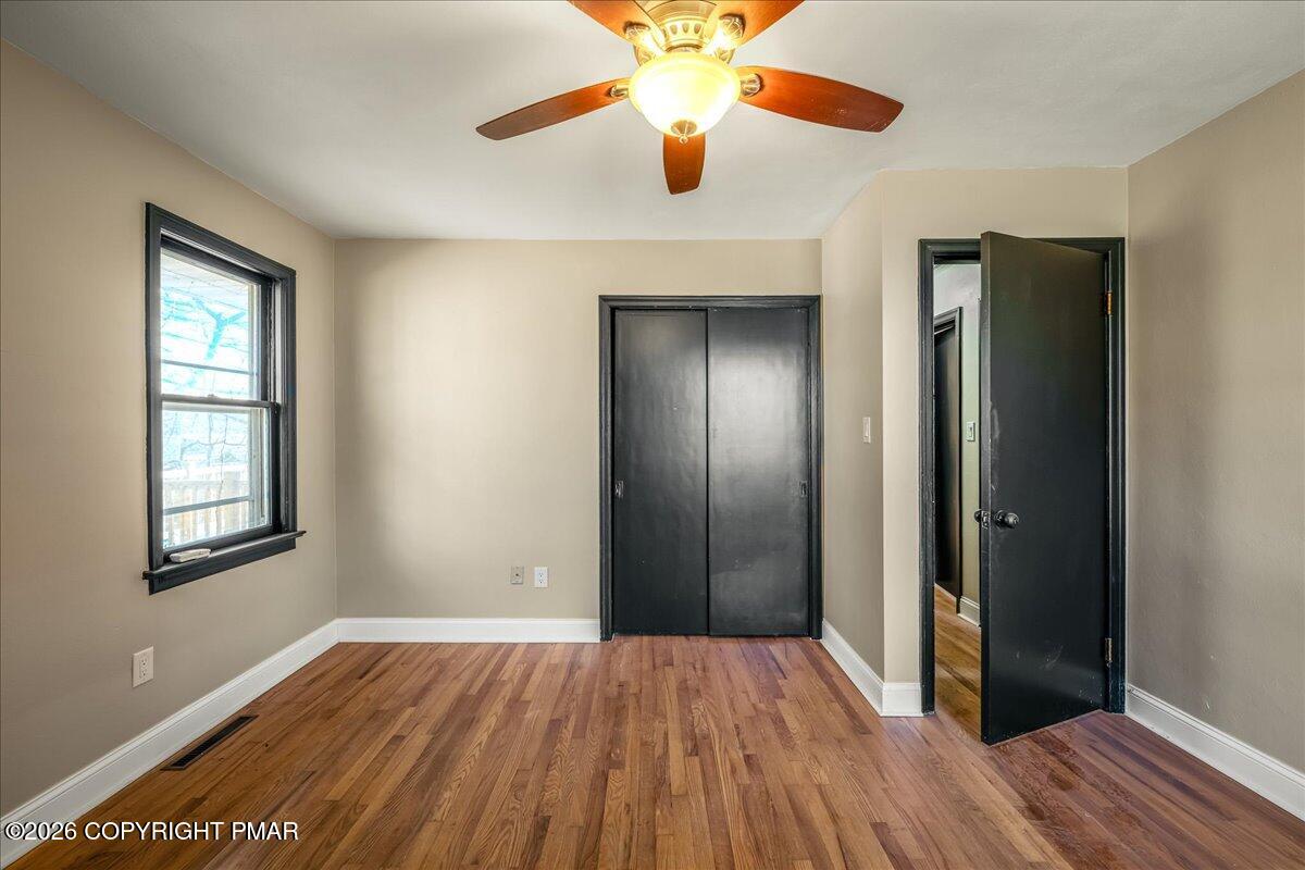 7136 Howell Terrace Stroudsburg, PA 18360 - Photo 19 of 35 wooden floor in an empty room with a window