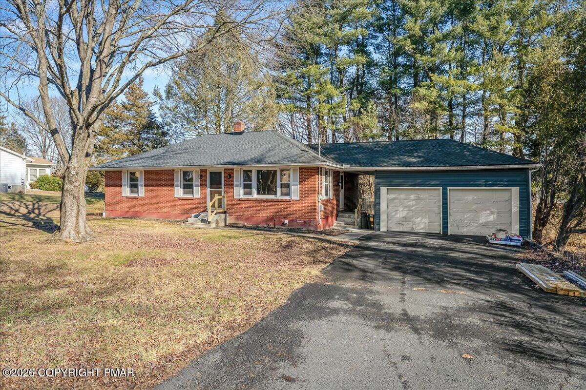 7136 Howell Terrace Stroudsburg, PA 18360 - Photo 35 of 35 a view of a house with a yard and large tree