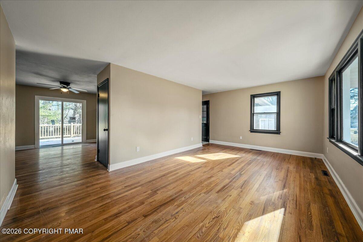 7136 Howell Terrace Stroudsburg, PA 18360 - Photo 4 of 35 wooden floor in an empty room with a window