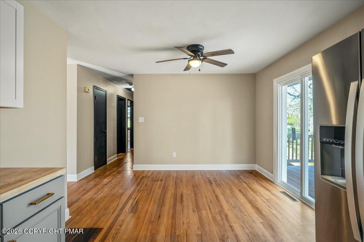 7136 Howell Terrace Stroudsburg, PA 18360 - Photo 10 of 35 a view of empty room with wooden floor and fan