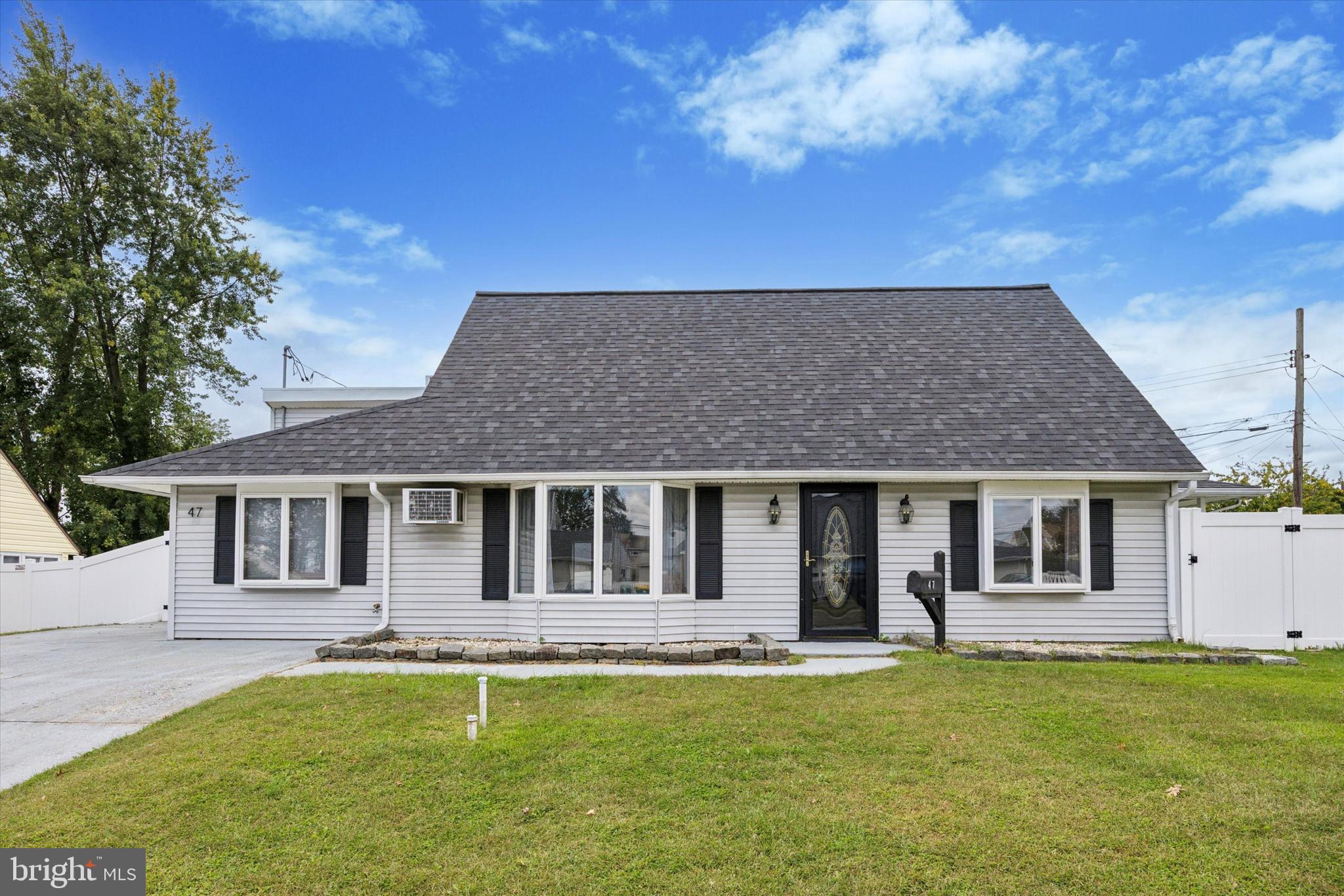 47 Cotton Road Levittown, PA 19057 - Photo 1 of 35 a front view of a house with a garden