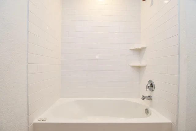 a close up of a bathtub curtain