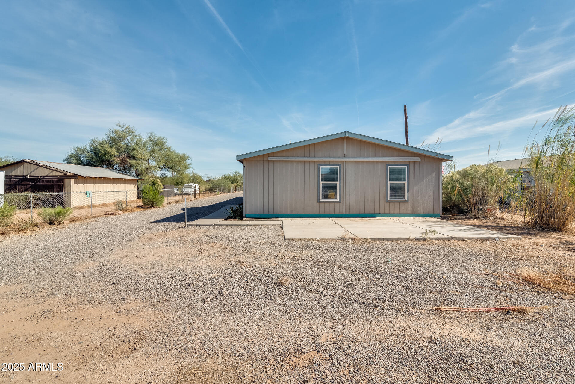 1047 South Main Street Coolidge, AZ 85128 - Photo 38 of 72 a front view of a house with a yard and garage