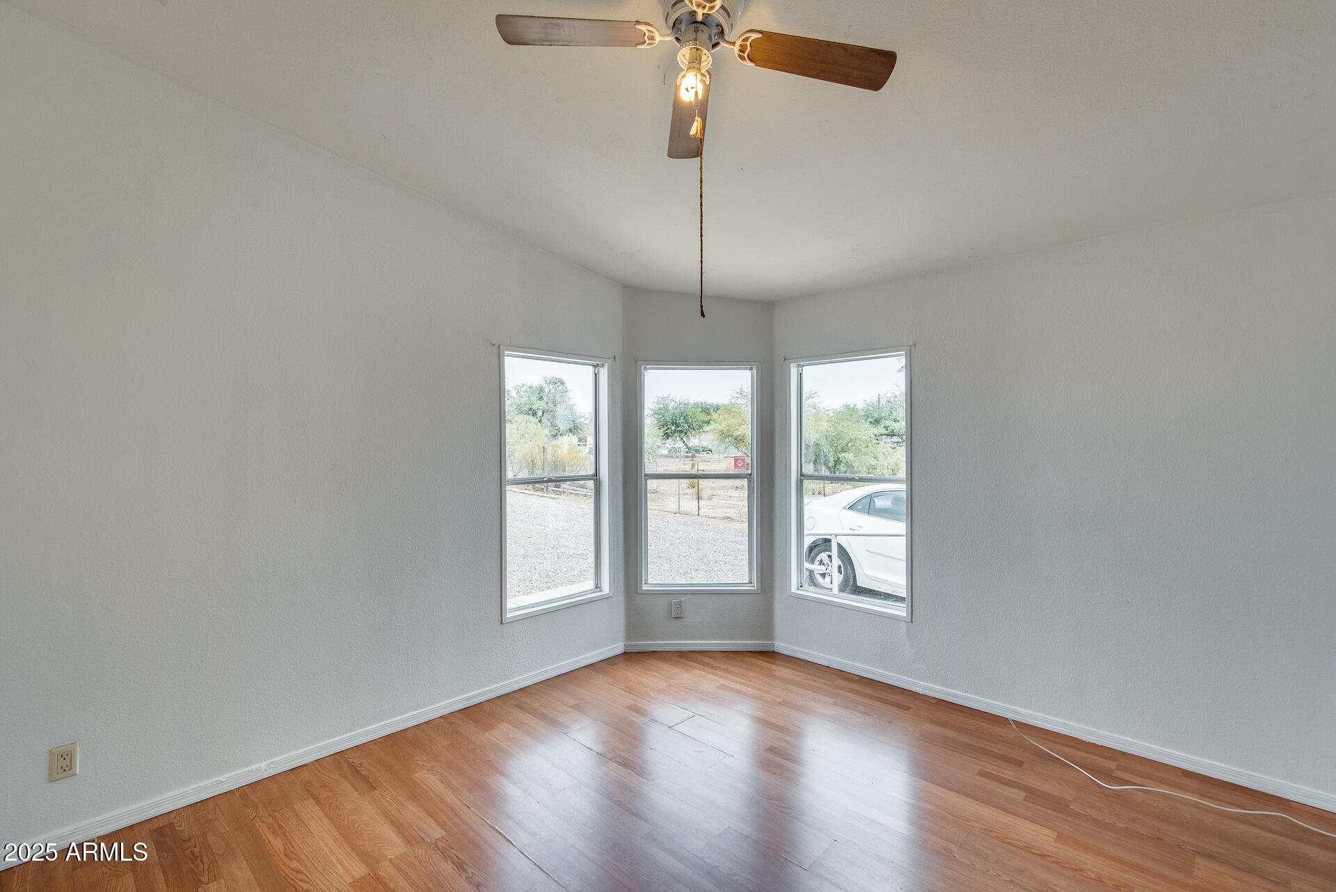 1047 South Main Street Coolidge, AZ 85128 - Photo 42 of 72 wooden floor in an empty room with a window