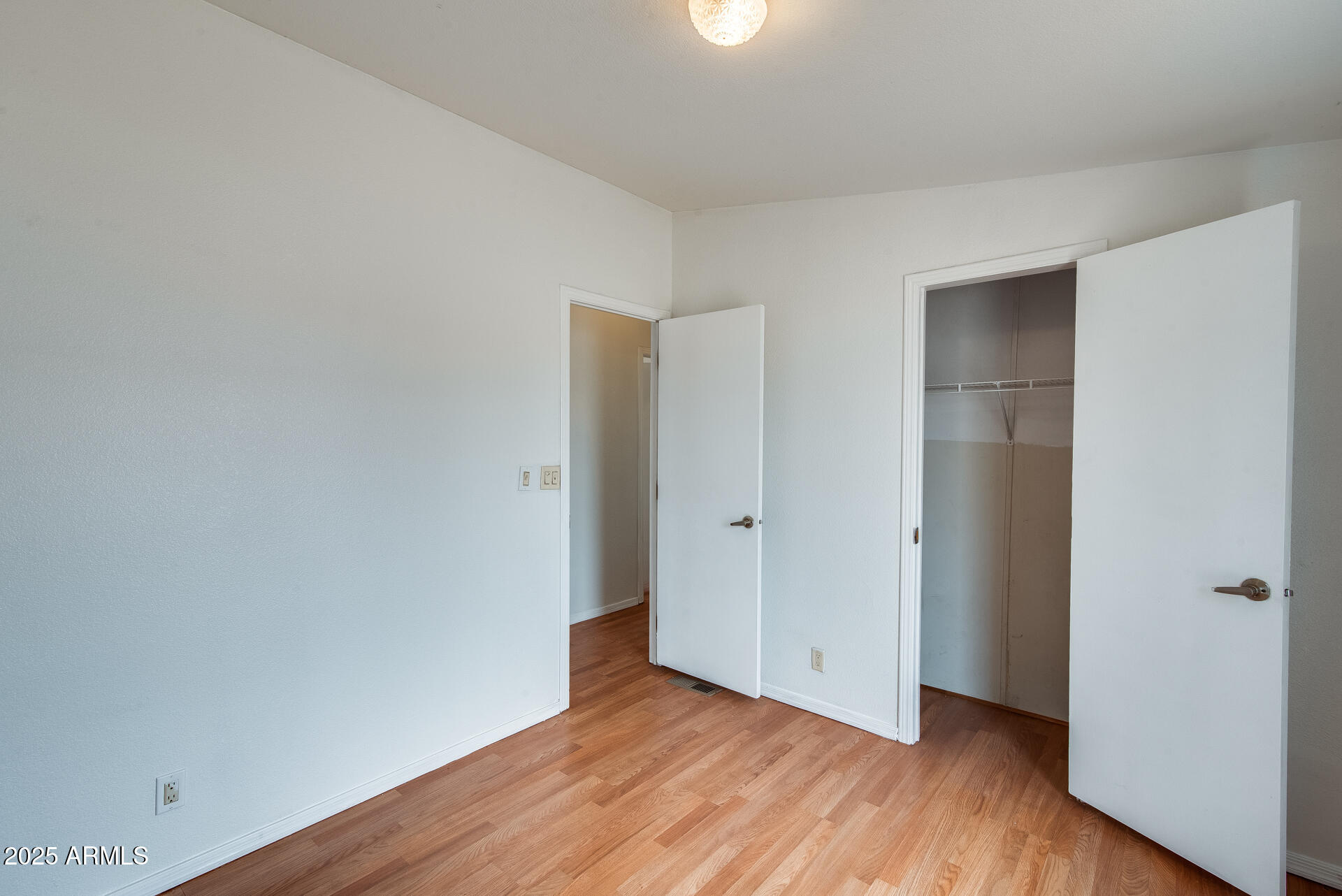 1047 South Main Street Coolidge, AZ 85128 - Photo 50 of 72 a view of an empty room with wooden floor