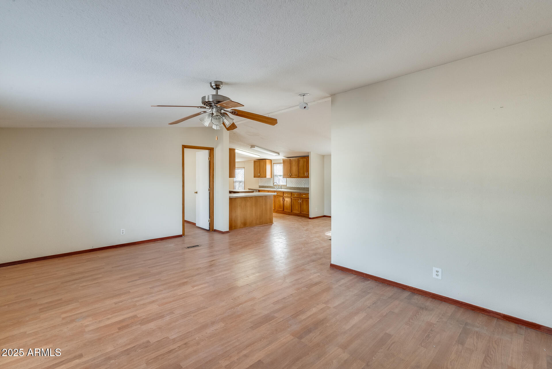 1047 South Main Street Coolidge, AZ 85128 - Photo 5 of 72 a view of a room with a wooden floor
