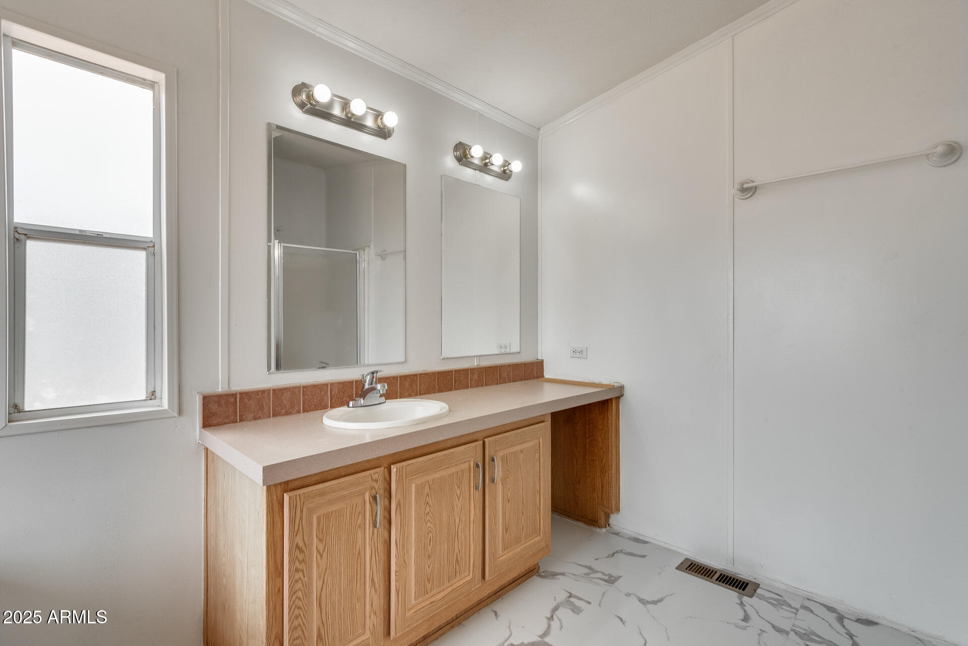 1047 South Main Street Coolidge, AZ 85128 - Photo 57 of 72 a bathroom with a granite countertop sink and a mirror