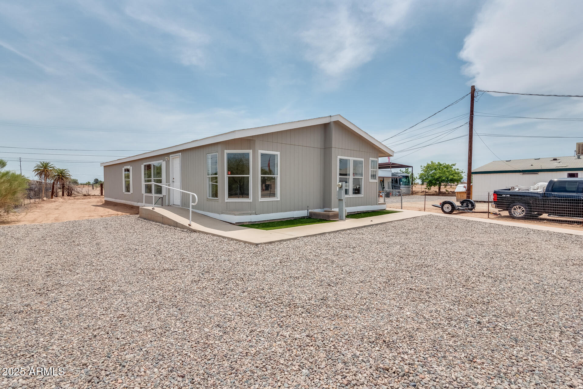 1047 South Main Street Coolidge, AZ 85128 - Photo 66 of 72 a view of a house with a backyard and porch