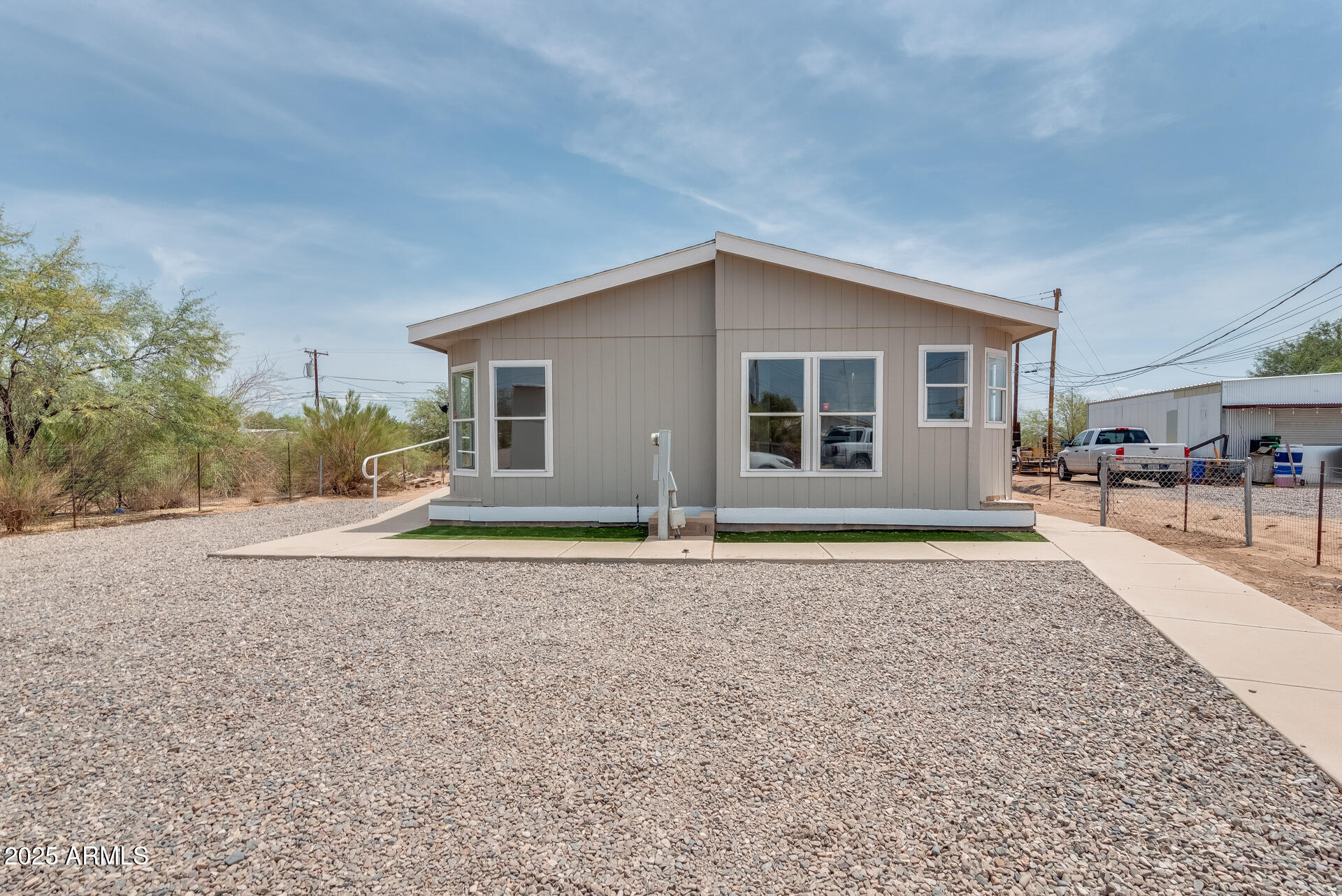 1047 South Main Street Coolidge, AZ 85128 - Photo 68 of 72 a view of a house with a yard and large tree