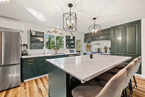 a kitchen with a stove and a sink