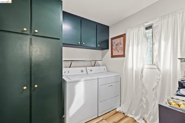 a living room with furniture a large window and a fireplace