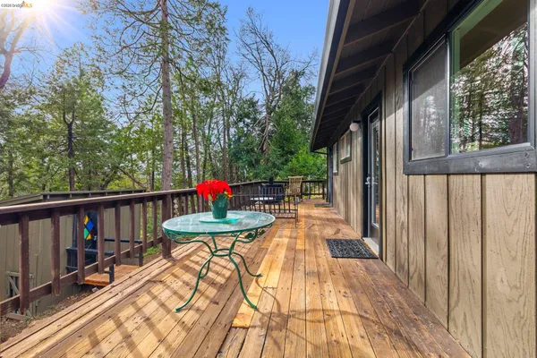 a view of a house with wooden fence