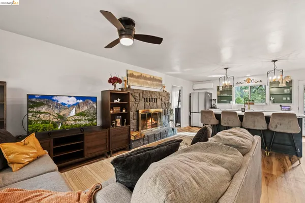 a view of a livingroom with furniture and a kitchen