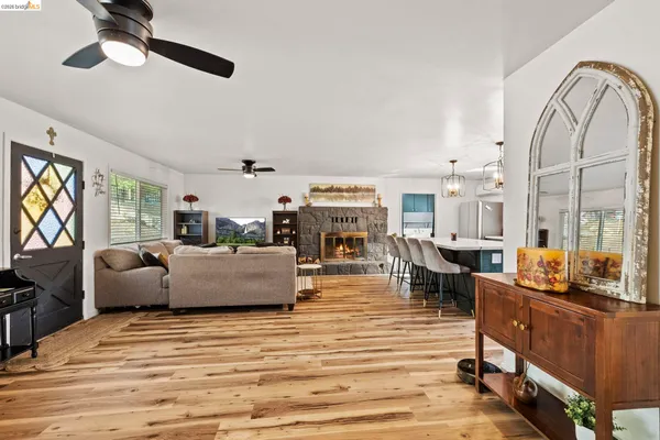 a kitchen with a table chairs and refrigerator