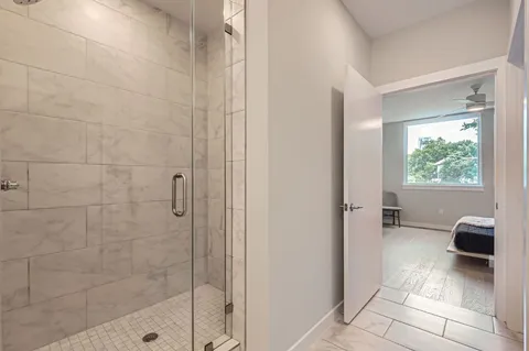 a bathroom with a bathtub and a shower