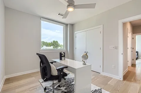 a workspace with furniture and a window