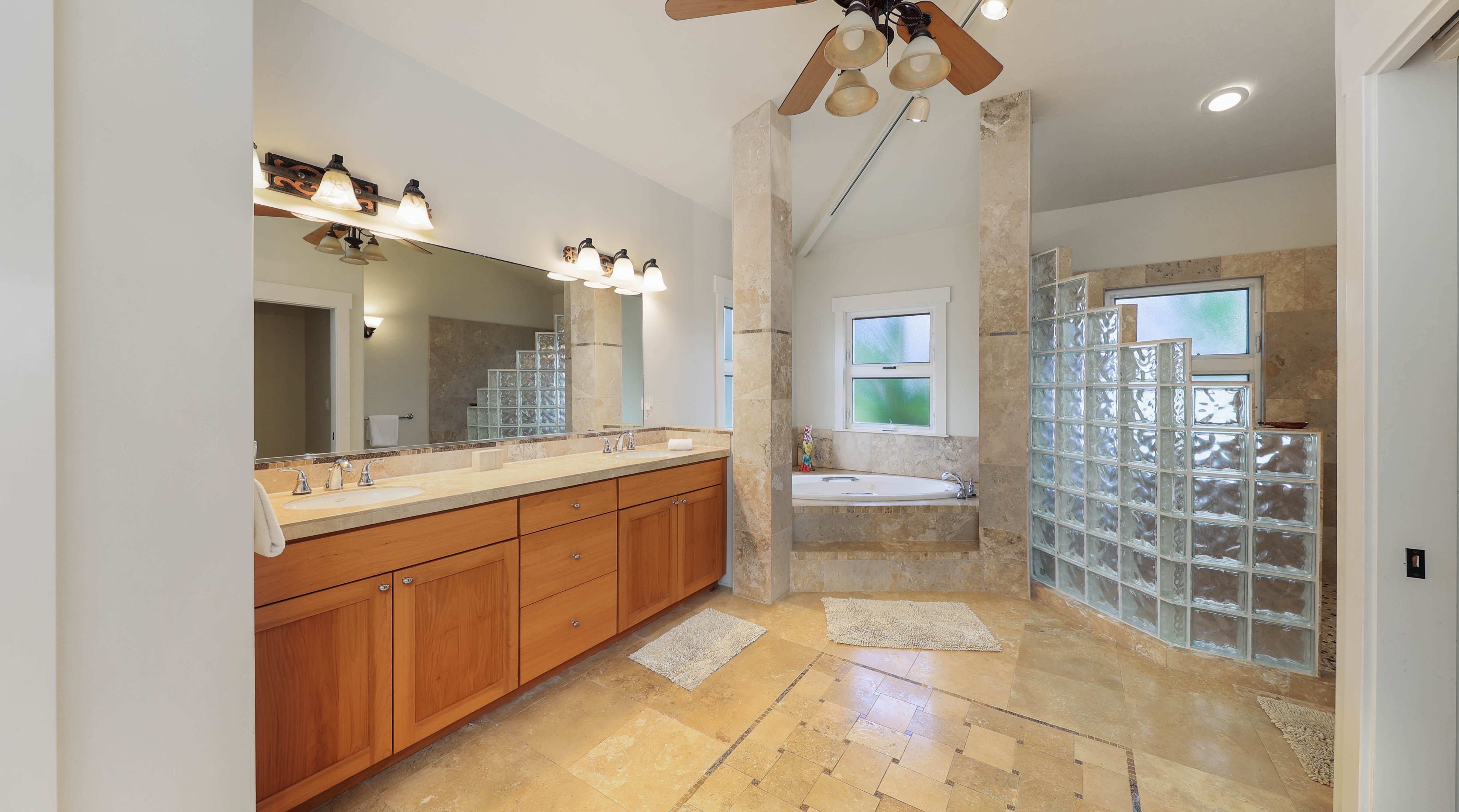 3570 Kaweonui Road Princeville, HI 96722 - Photo 19 of 30 a bathroom with a double vanity sink and a mirror