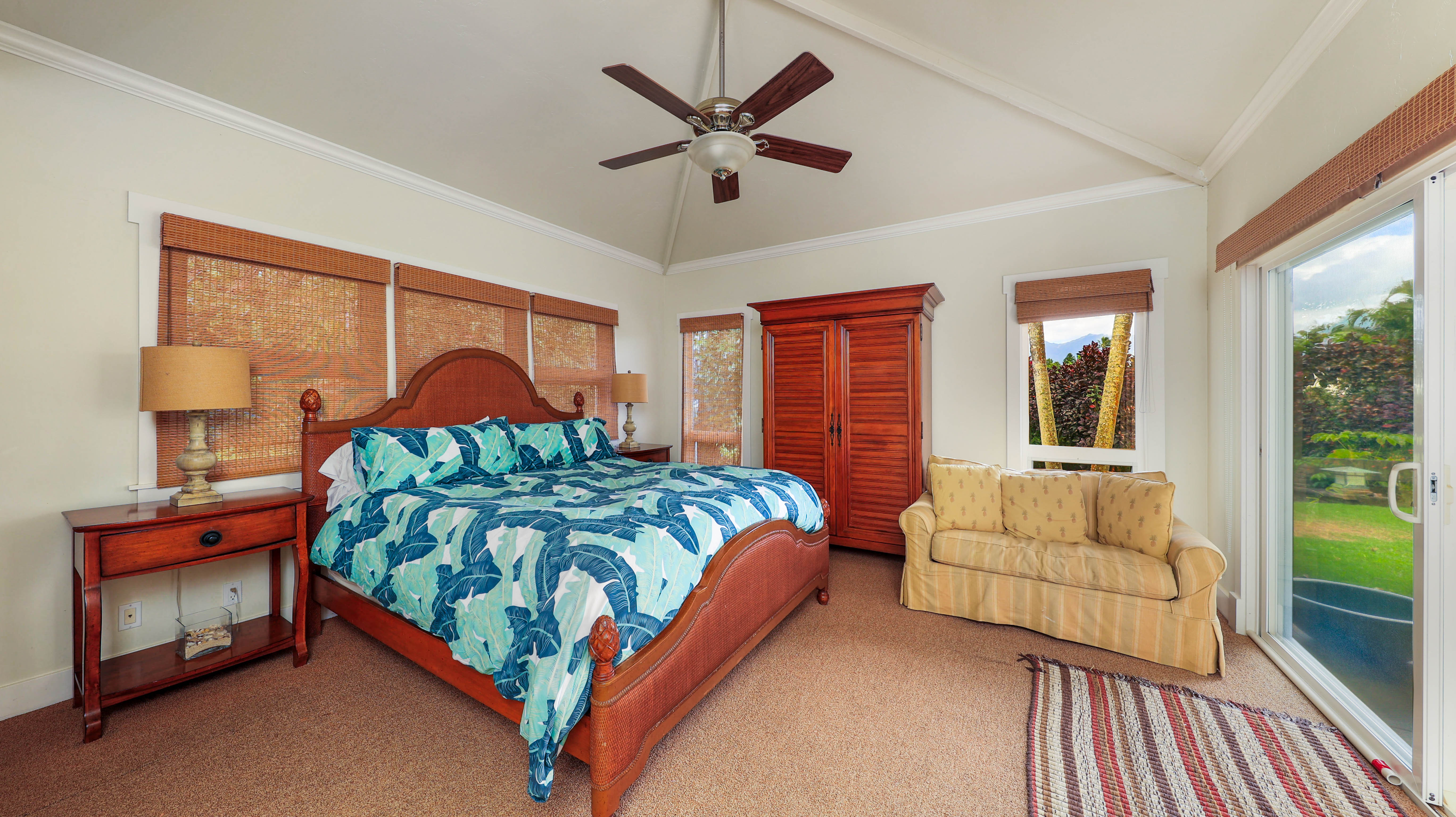 3570 Kaweonui Road Princeville, HI 96722 - Photo 20 of 30 a bedroom with a bed and window