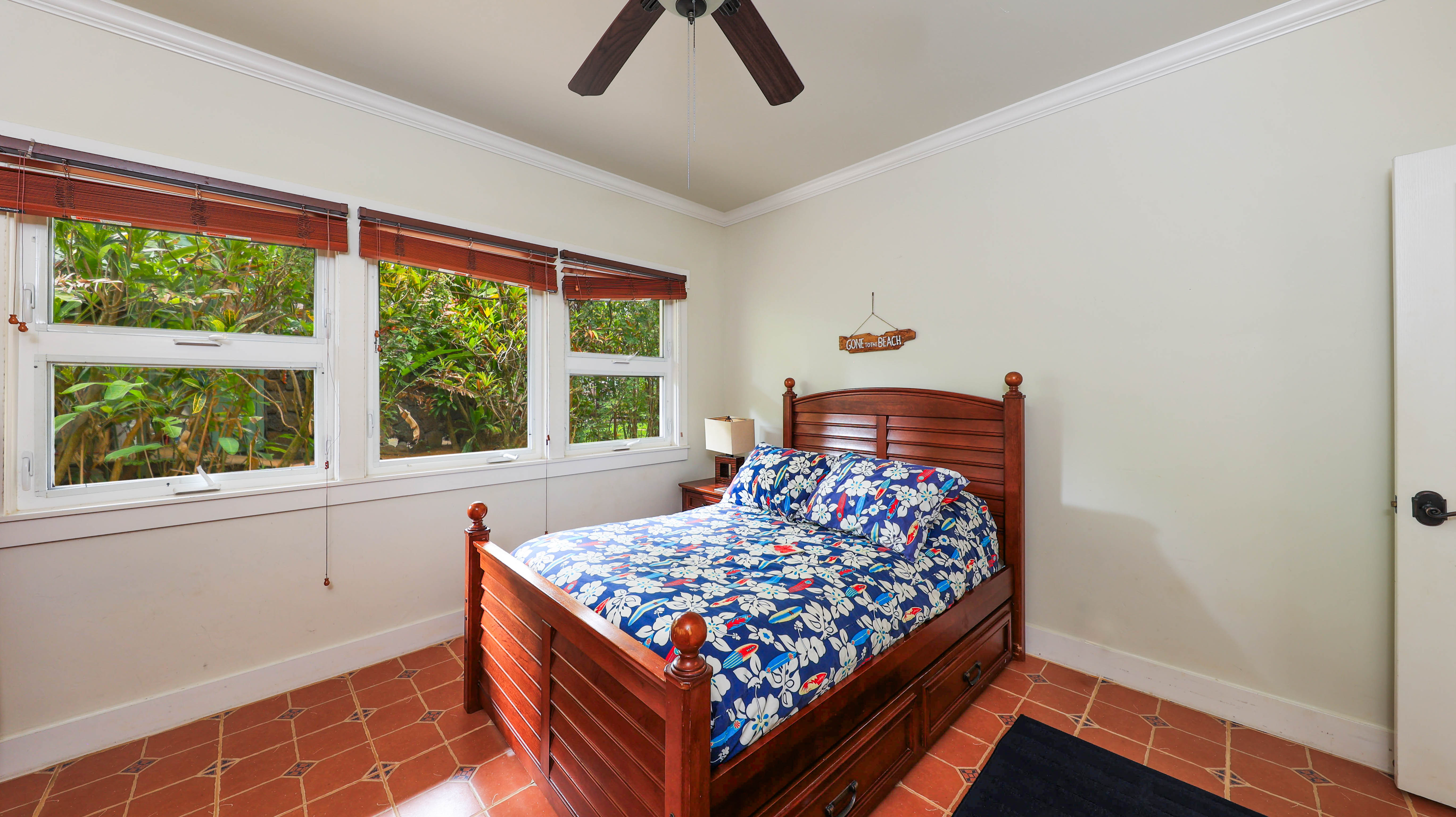 3570 Kaweonui Road Princeville, HI 96722 - Photo 23 of 30 a bedroom with a bed and window