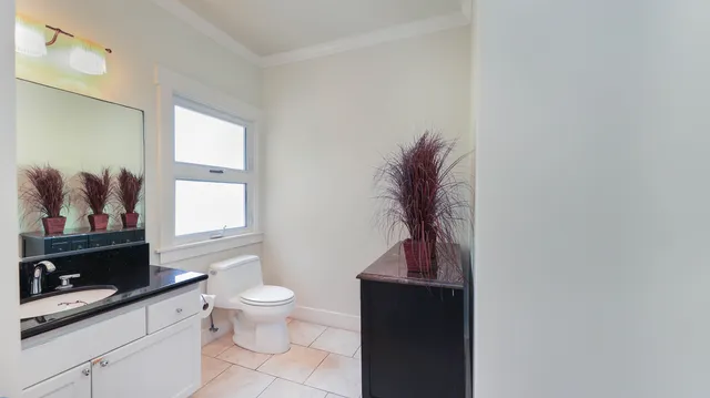 a living room with furniture and a toilet