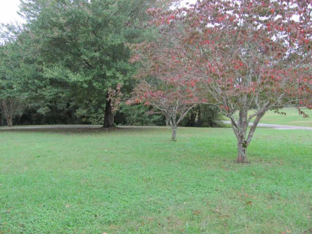 212 Duckworth Road Winchester, TN 37398 - Photo 10 of 16 a view of outdoor space with deck and yard