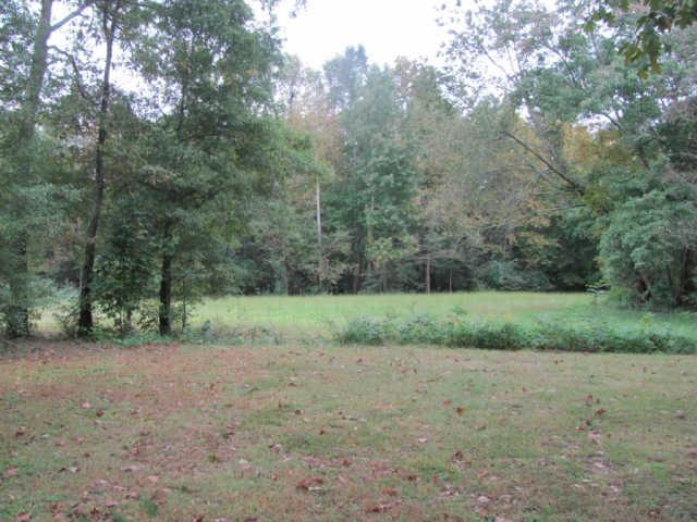 212 Duckworth Road Winchester, TN 37398 - Photo 11 of 16 a view of a field with trees in background