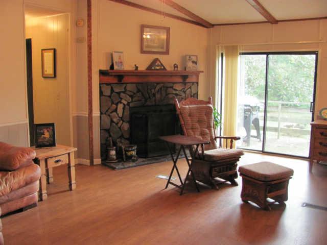 212 Duckworth Road Winchester, TN 37398 - Photo 3 of 16 a view of a livingroom with furniture and a fireplace