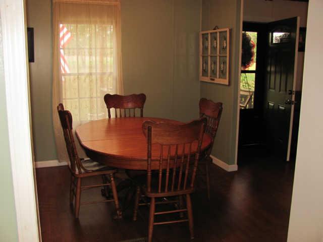 212 Duckworth Road Winchester, TN 37398 - Photo 16 of 16 a view of a dining room with furniture and wooden floor