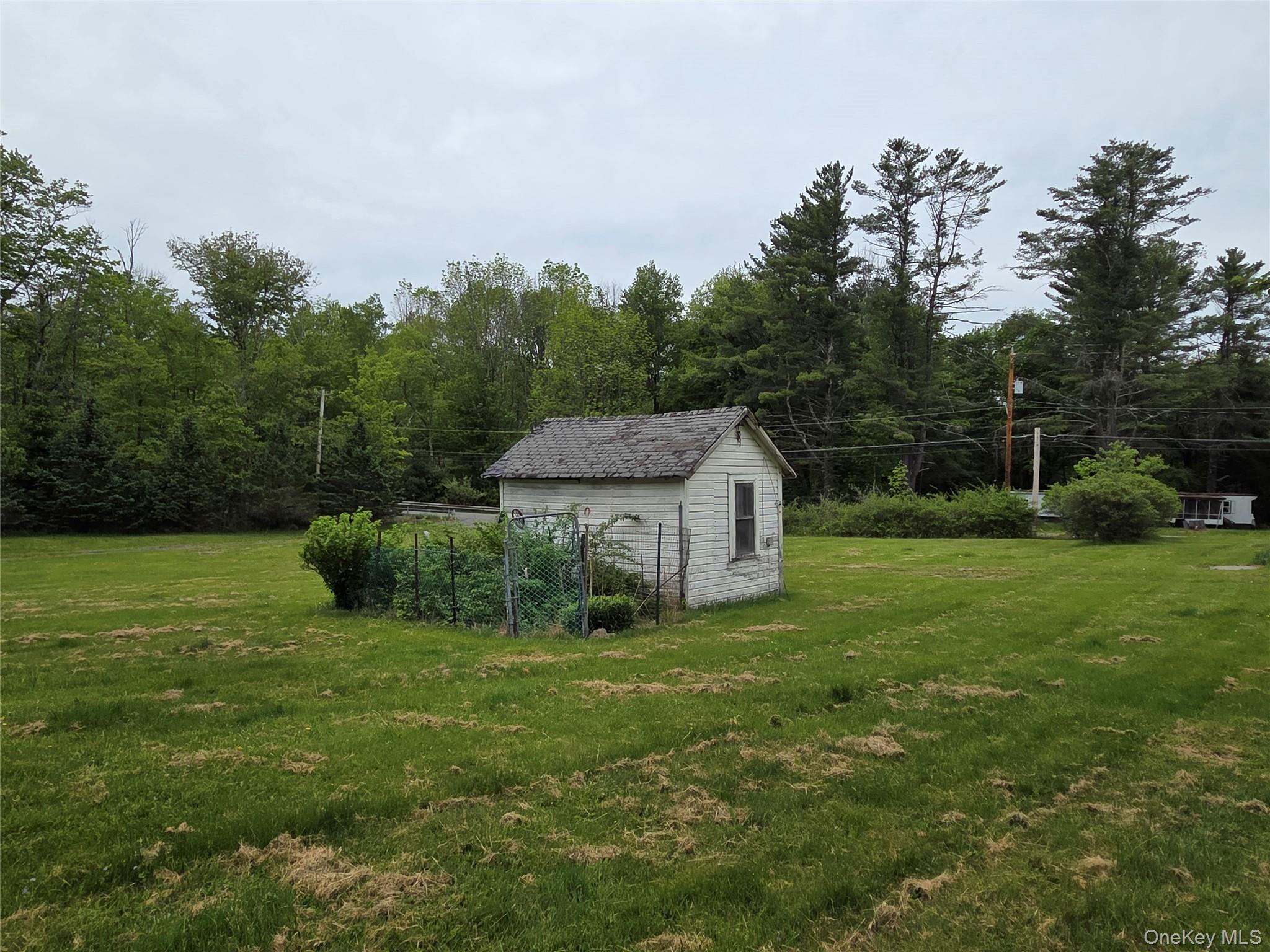 125 Zimmerman Road Loch Sheldrake, NY 12759 - Photo 36 of 43 a view of a house with a yard and sitting area